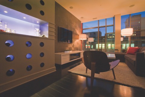 Living room with luxurious Lutron lights and shades.