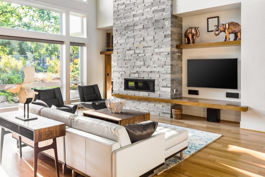 A living room space showing a seating area and various AV solutions.